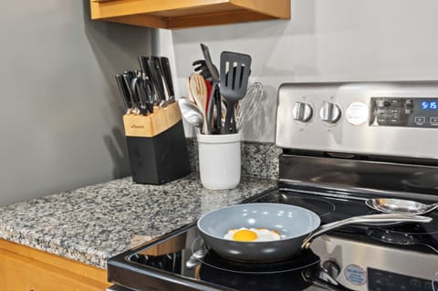 Kitchen: A modern kitchen with granite countertops and stainless steel appliances.