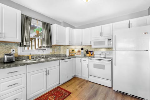 The open, airy kitchen offers ample space & every home comfort