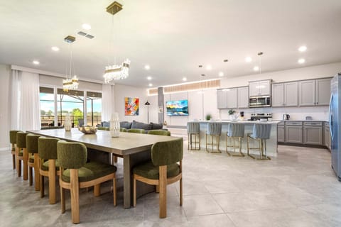 Expansive open-plan kitchen, dining, and living area with chic modern design