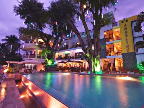 Outdoor pool, open 7 AM to 7:00 PM, pool umbrellas, sun loungers