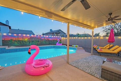 Poolside Paradise – A dreamy pool with fun inflatables and a stunning mural