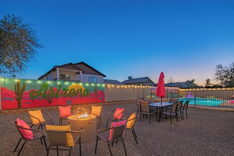 Cozy up around the fire pit with friends, with a colorful Arizona mural setting