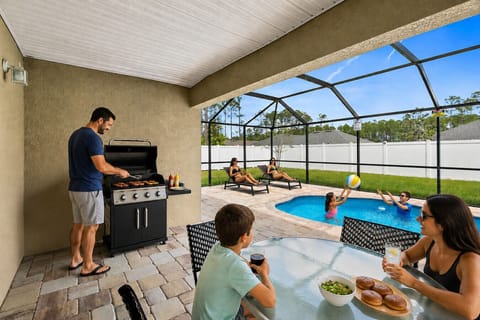 Family pool days, outdoor dining, and cookouts under the screened lanai