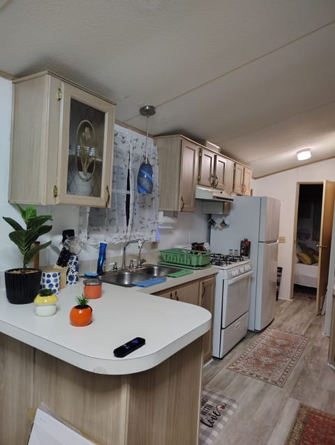 beautiful kitchen area able to seat 4 with lots of lighting.