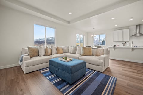 Soak in the mountain views from the living room, framed by three sets of windows that flood the space with natural light.