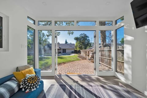 Enjoy a private tranquil escape in this bright sunroom, perfect for relaxation and Redding light.