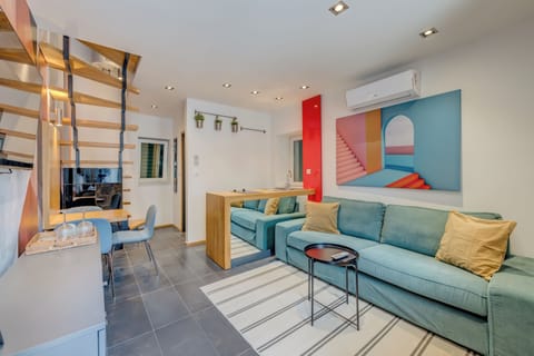 Apartment, 2 Bedrooms | Living area | 100-cm flat-screen TV with cable channels