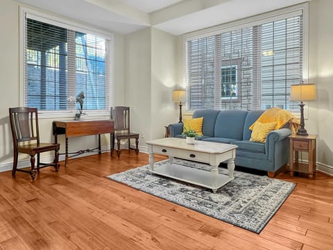 Step into your spacious an comfy living area complete with vaulted ceilings and lavish wood flooring