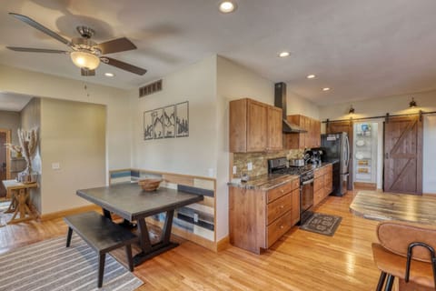 View from spiral staircase into the dining room and kitchen