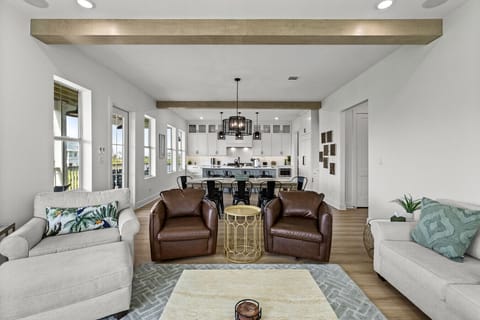 Plenty of space to stretch out in this airy, open living room — perfect for relaxing after a day at the beach
