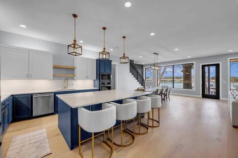 Kitchen and island with comfortable seating