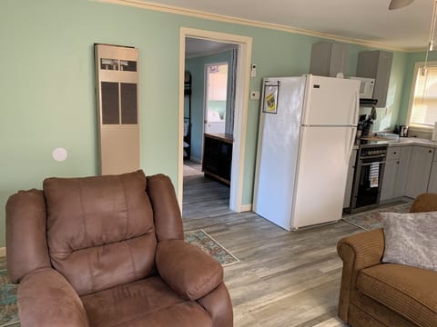 LIVING ROOM: Living room with the kitchenette in the background