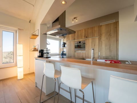 Furniture, Kitchen, Countertop, Interior Design, Flooring, Floor, Wood, Cabinetry, Kitchen Appliance, Ceiling