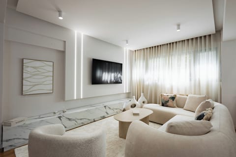 Luxury Apartment | Living area | 65-inch Smart TV with digital channels