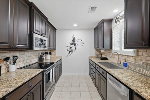 With beautiful wooden cabinets and a functional galley-style layout, this fully equipped kitchen was made for whipping up southern classics!
