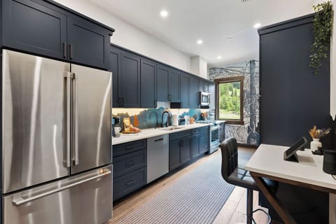 The fully equipped kitchen provides the ideal setting to craft delicious meals during your alpine getaway.