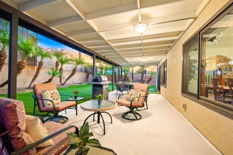 Outdoor dining is available near the BBQ for simple backyard meal prep.