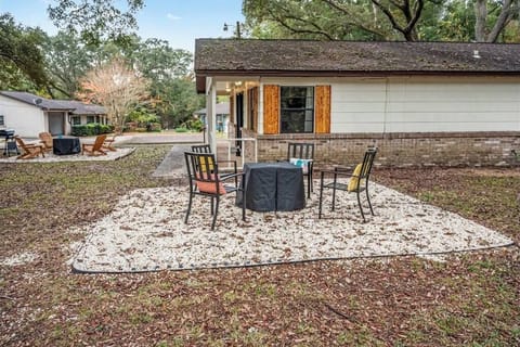 Spacious backyard w/ gravel patio, firepit seating & room to unwind under the open sky