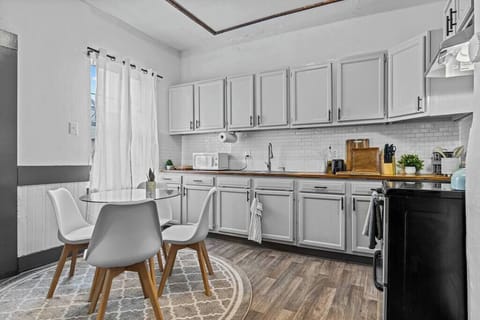 Fully equipped kitchen with modern appliances and a chic dining nook. Enjoy cooking and dining in a space that feels like home.