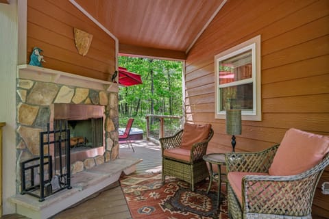 Outdoor wood fireplace on covered porch :)