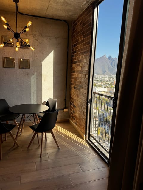 Deluxe Apartment, Balcony, City View | Dining room