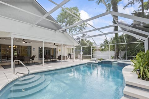 Relax and unwind in your private screened-in pool oasis! The spacious back patio is ideal for sunbathing or sipping your morning coffee.