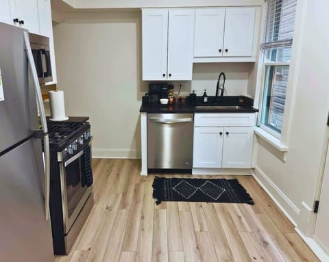 Elevate your culinary experience at Jungle House Airbnb with our sleek and modern kitchen, complete with stainless steel appliances and elegant finishes  Your gourmet retreat in Short North Columbus