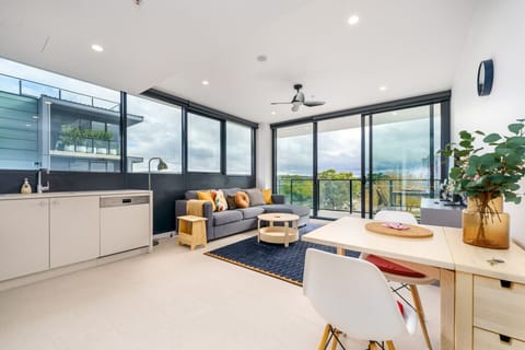 Relax in this bright and cozy space with a comfy lounge, dining area, and fully equipped kitchen. The glass sliding door fills the room with natural light—perfect for a peaceful stay or a weekend getaway. You`ll feel right at home here!