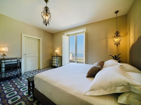 Deluxe Double or Twin Room, Sea View | Minibar, in-room safe, individually decorated, individually furnished