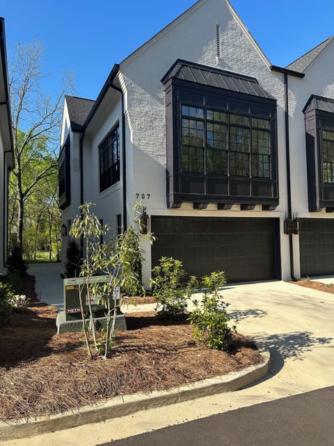 New Construction Townhome with 2 car garage and parking for 2 additional cars.