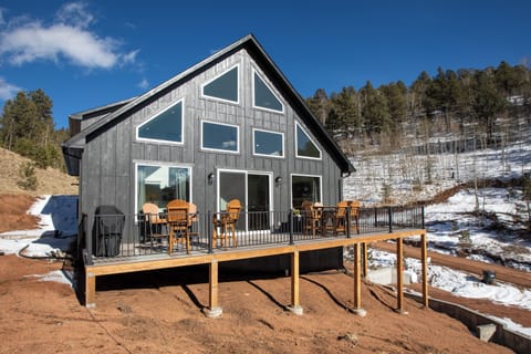 Deck with outdoor patio dining set and gas grill