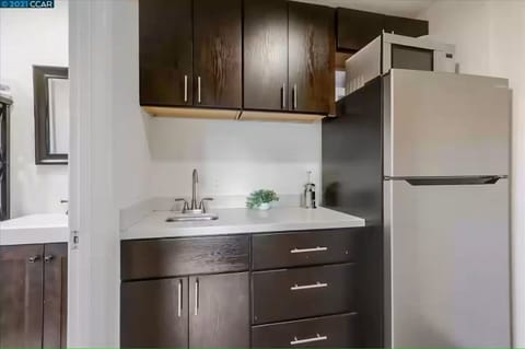 Newly remodeled kitchenette with full sized refrigerator. No stove or oven. 
