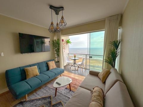 Family Apartment, Beach View | Living area | Flat-screen TV