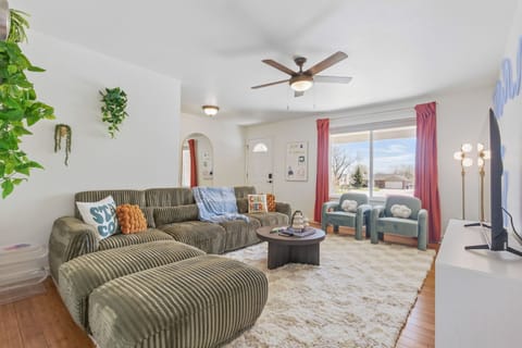 Unwind in a bright living room with 2 cloud chairs