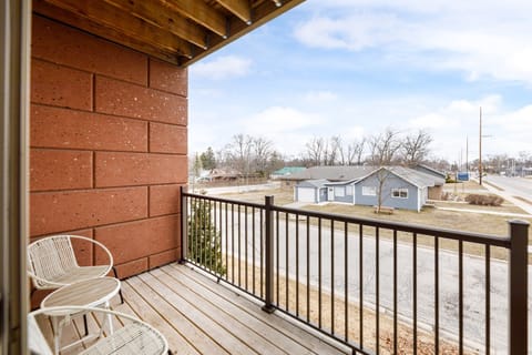 Step onto the private balcony & enjoy fresh air with neighborhood views.