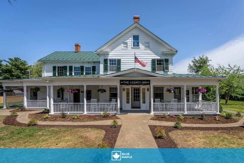 Historic inn with a spacious wraparound porch and garden seating