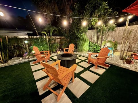 Gather around the fire pit for cozy evenings under the café lights.