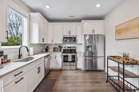 Enjoy the bright, spacious and fully-equipped kitchen for all your cooking needs. Stainless steel appliances, coffee maker, and all the utensils you might need are provided.