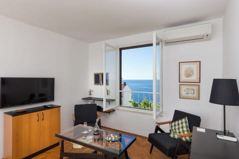 Apartment (One Bedroom Apartment with Loggia and) | Living room | 32-inch flat-screen TV with cable channels