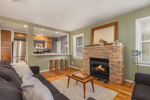 Cozy Up Next to the Fireplace in the Living Room with a Good Book and Your Morning Brew
