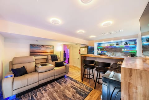 Unwind in your stylish open-concept space where the living area flows into a modern kitchen with breakfast bar seating.