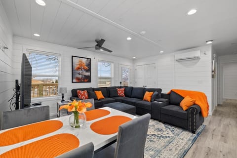 Designed for gathering, this bright and inviting living room offers plenty of comfortable seating to unwind with family and friends.