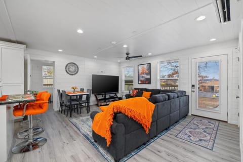 Spacious, light-filled living area with comfy seating and room to relax together.