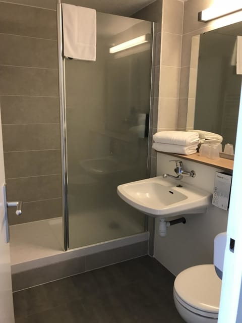 Bathtub, eco-friendly toiletries, hair dryer, towels