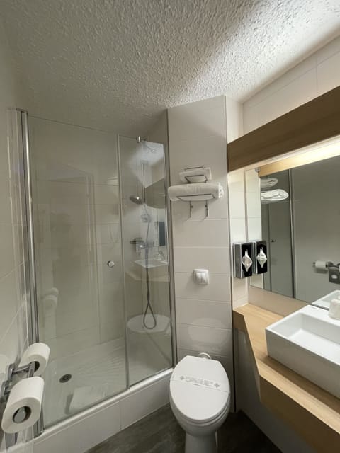 Shower, eco-friendly toiletries, hair dryer, towels