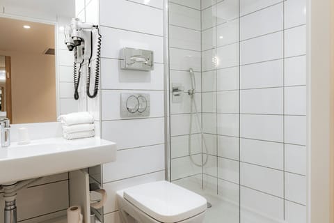 Shower, eco-friendly toiletries, hair dryer, towels