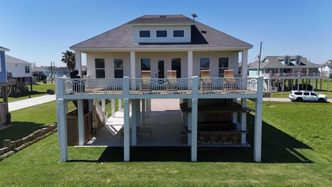 Enjoy your own outdoor paradise with a tiki bar, BBQ, and enclosed shower – all just steps from the beach.