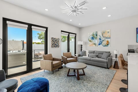 Relax in this spacious living room with plenty of natural light.