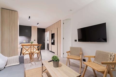 Chic open-plan living area with modern amenities, perfect for relaxing and dining in style.