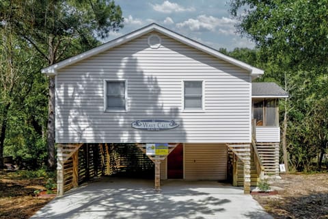 Welcoming beach cottage nestled on a wooded lot w/ plenty of parking & privacy.